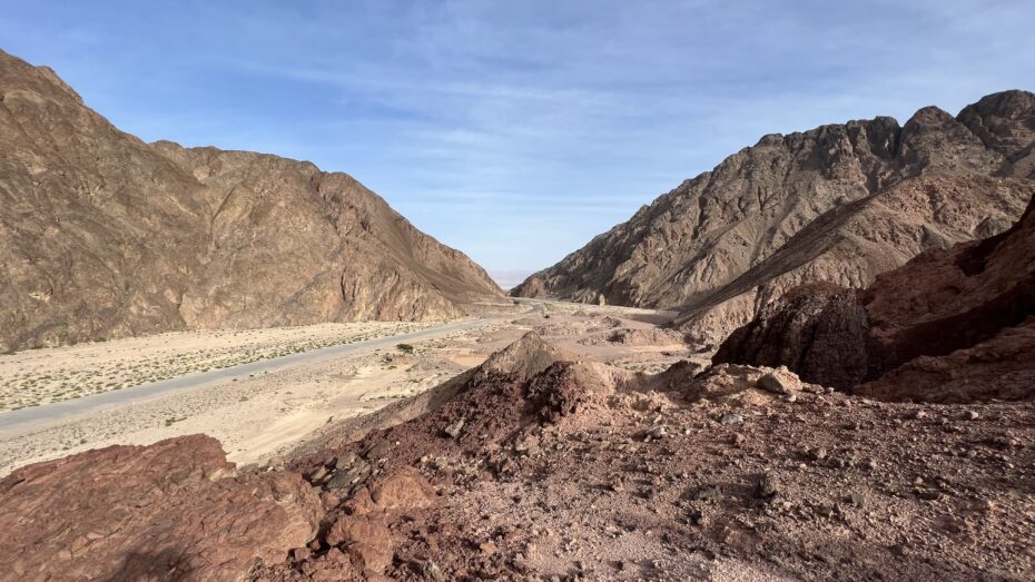 The winding canyon of Wadi Watir. This dry riverbed canyon is the only ancient route from the interior of the Sinai Peninsula to a large enough beach on the Red Sea (Gulf of Aqaba) that is surrounded by mountains on all sides. Pharaoh believed the Israelites were lost and entangled in the wilderness and trapped by the sea and pursued them with his military. In the distance you can see the Red Sea and the mountains of Saudi Arabia (ancient Midian) in the distance.